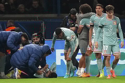 UEFA Champions League: Atletico Madrid's Angel Correa, on the ground, celebrates after scoring the second goal against PSG