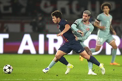 UEFA Champions League: Atletico Madrid's Rodrigo De Paul, right, and PSG's Joao Neves fight for the ball