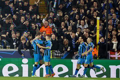 UEFA Champions League: Brugge's Hans Vanaken, left, celebrates with teammates after scoring a penalty his side's first goal
