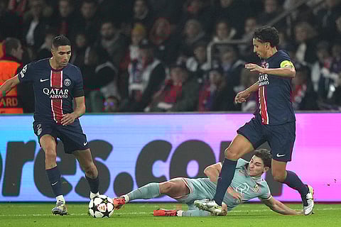 UEFA Champions League: PSG's Achraf Hakimi, left, Marquinhos, right, and Atletico Madrid's Julian Alvarez