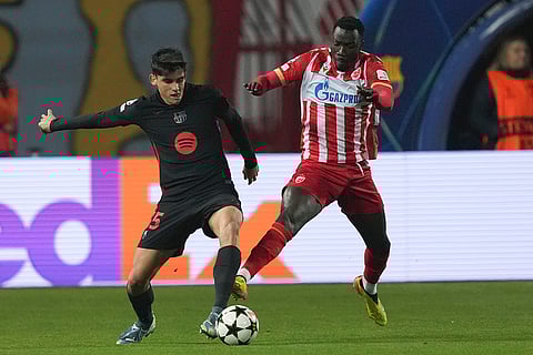UEFA Champions League: Barcelona's Gerard Martín, left, and Red Star's Silas fight for the ball