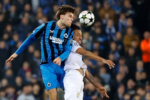 UEFA Champions League: Brugge's Bjorn Meijer, left, and Aston Villa's Boubacar Kamara jump for the ball