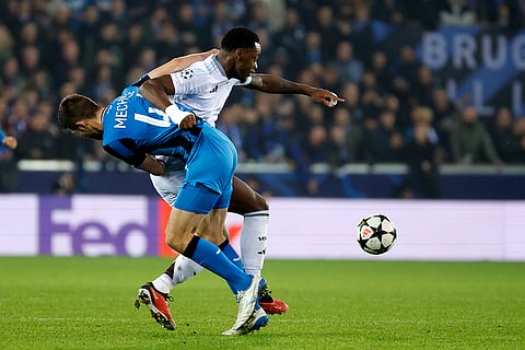 UEFA Champions League: Aston Villa's Jhon Duran, background, and Brugge's Brandon Mechele fight for the ball