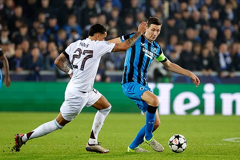 UEFA Champions League: Brugge's Hans Vanaken, right, and Aston Villa's Morgan Rogers fight for the ball