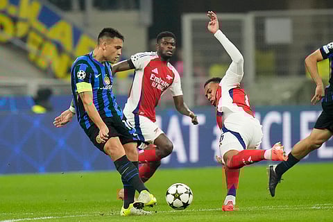UEFA Champions League: Inter Milan's Lautaro Martinez, left, challenges for the ball with Arsenal's Gabriel