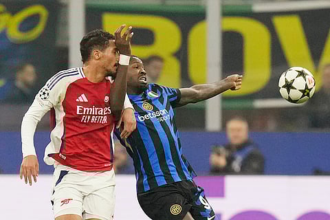 UEFA Champions League: Inter Milan's Marcus Thuram, right, challenges for the ball with Arsenal's William Saliba