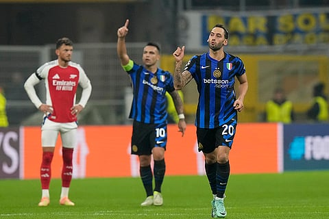 UEFA Champions League: Inter Milan's Hakan Calhanoglu, right, celebrates after scoring his side's opening goal