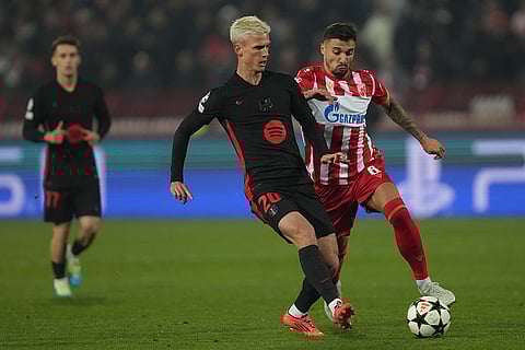 UEFA Champions League: Barcelona's Dani Olmo passes the ball in front of Red Star's Guelor Kanga
