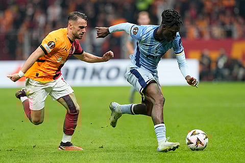 Europa League: Tottenham's Yves Bissouma challenges for the ball with Galatasaray's Yunus Akgun