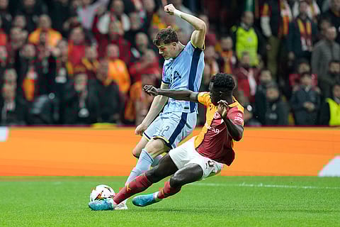 Europa League: Tottenham's Will Lankshear, left, is tackled by Galatasaray's Davinson Sanchez