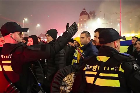 Europa League Netherlands Israel Fan Violence: Police escort Maccabi Tel Aviv supporters to the metro station leading them to the Ajax stadium
