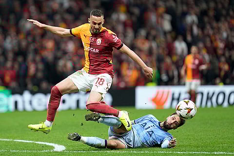 Europa League: Galatasaray's Berkan Kutlu challenges for the ball Tottenham's Rodrigo Bentancur