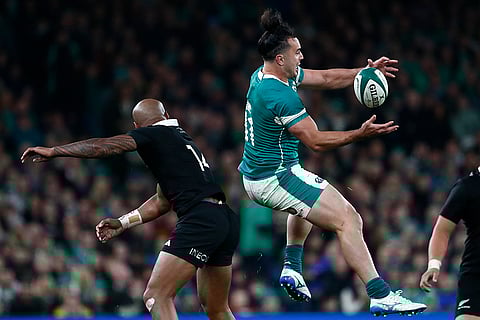 Autumn Nations Series: Ireland's James Lowe, right catches a loose ball under pressure from New Zealand's Mark Tele'a