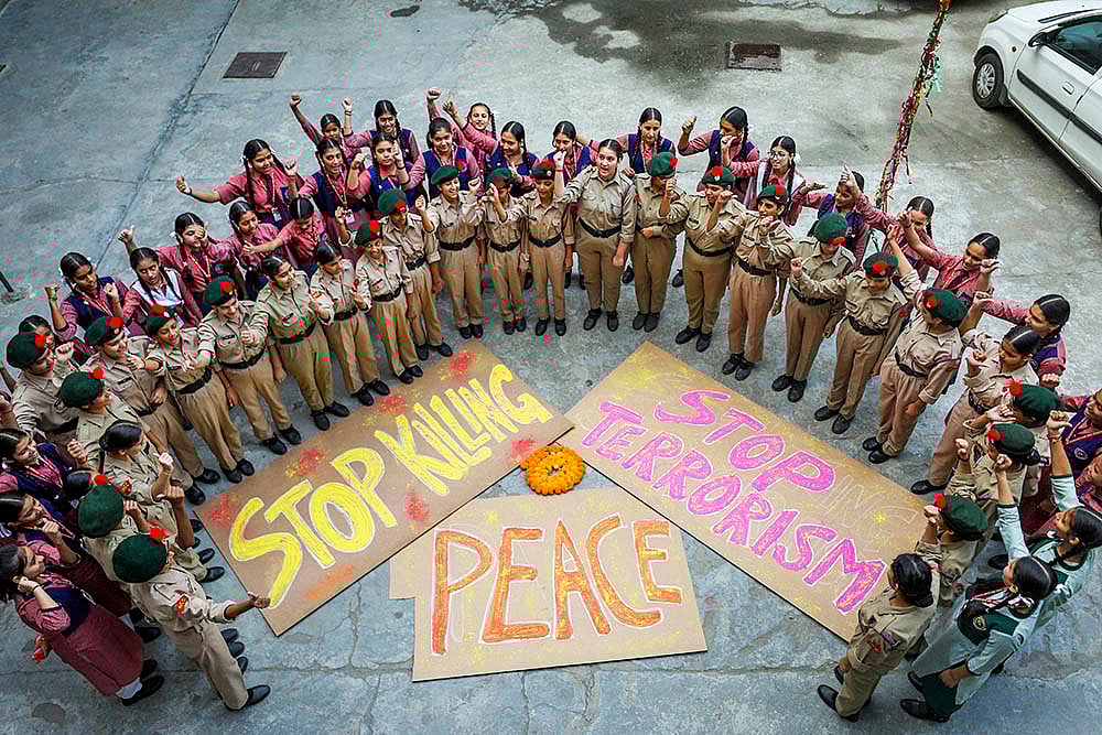 |  Photo: PTI : Students raise slogans against terror attacks in J-K