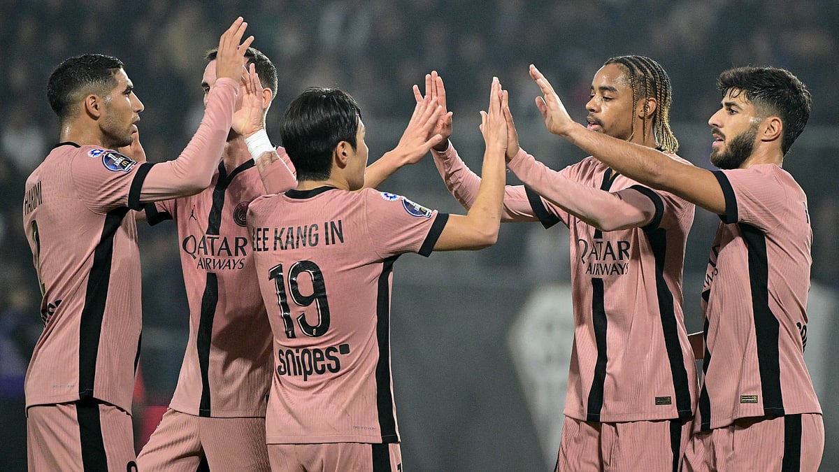 PSG celebrate their fourth goal.