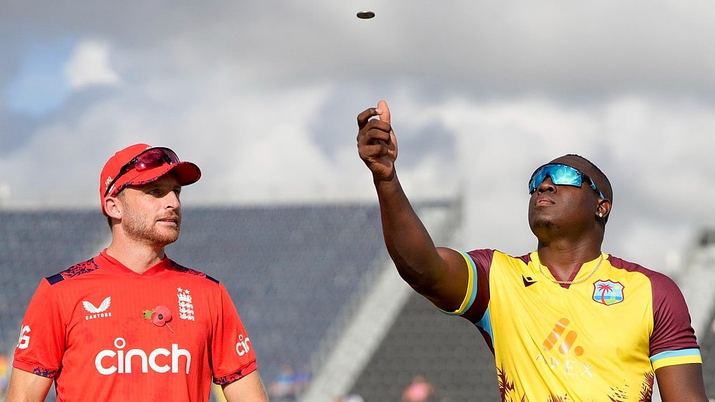 AP/Ricardo Mazalan : Captains Jos Buttler and Rovman Powell at the toss for the West Indies vs England, 1st T20I in Barbados. 