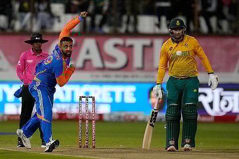 South Africa vs India: India's bowler Varun Chakravarthy, left, watches on his delivery