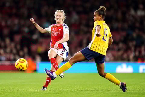 Women's Super League: Arsenal's Leah Williamson, left, and Brighton and Hove Albion's Nikita Parris battle for the ball