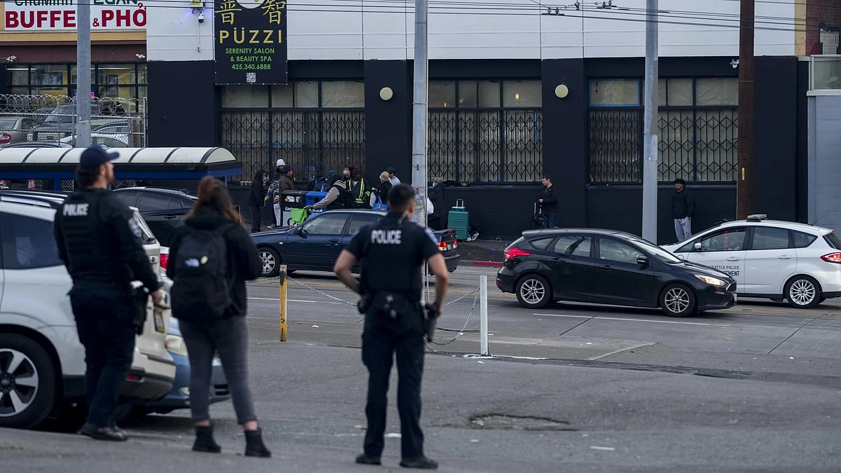 AP : Police investigating at the scene of stabbing spree in Seattle.