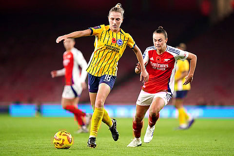 Women's Super League: Brighton and Hove Albion's Maisie Symonds, left, and Arsenal's Caitlin Foord battle for the ball