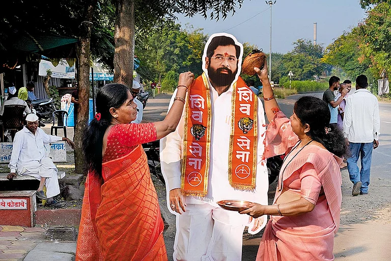 Cut-out for Shinde: Women from Shilapur near Nashik with a cut-out of Eknath Shinde on November 4, 2024 - | Photo: Suresh K. Pandey