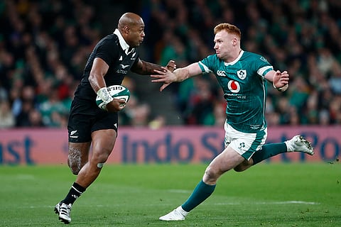 Autumn Nations Series: New Zealand's Mark Tele'a, left is challenged by Ireland's Ciaran Frawley
