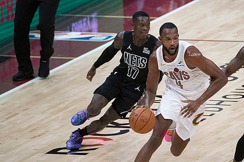 NBA: Cleveland Cavaliers' Evan Mobley (4) drives past Brooklyn Nets' Dennis Schroder