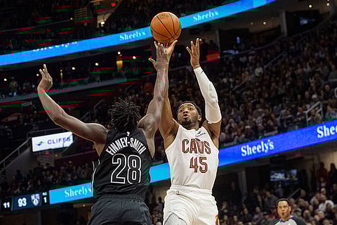 NBA: Cavaliers' Donovan Mitchell (45) shoots over Nets' Dorian Finney-Smith (28)
