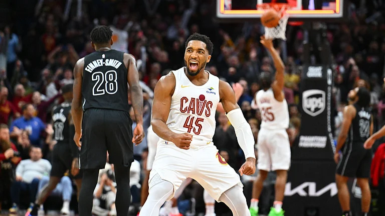 Donovan Mitchell #45 of the Cleveland Cavaliers celebrates after the Cavaliers defeated the Brooklyn Nets at Rocket Mortgage Fieldhouse on November 09, 2024 in Cleveland, Ohio. The Cavaliers defeated the Nets 105-100. - null
