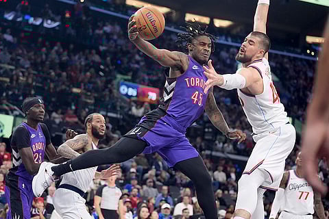 NBA: Toronto Raptors guard Davion Mitchell (45) is defended by Los Angeles Clippers center Ivica Zubac