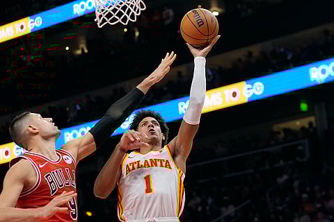NBA: Atlanta Hawks forward Jalen Johnson (1) shoots as Chicago Bulls center Nikola Vucevic