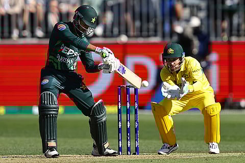 AUS Vs PAK, 3rd ODI: Pakistan's Saim Ayub, left, bats in front of Australia's Josh Inglis