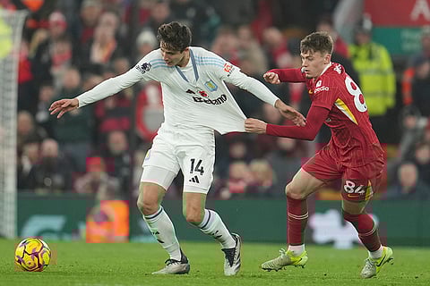 EPL 2024-25: Aston Villa's Pau Torres, left, and Liverpool's Conor Bradley battle for the ball