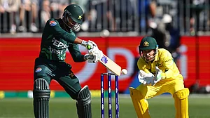 AP Photo/Trevor Collens : Pakistan's Saim Ayub, left, bats in front of Australia's Josh Inglis during their one-day international cricket match in Perth.