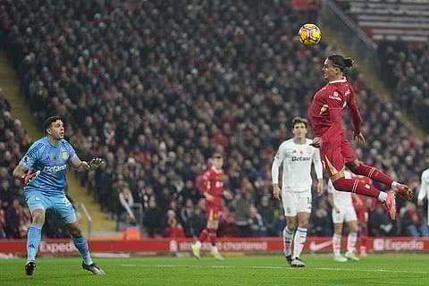 EPL 2024-25: Liverpool's Darwin Nunez, right, heads a ball next to Aston Villa's goalkeeper Emiliano Martinez