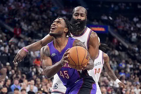 NBA: Raptors guard Davion Mitchell (45) drives past Clippers guard James Harden
