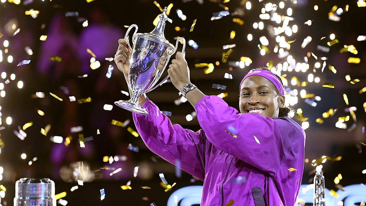 AP Photo : Coco Gauff of the U.S. holds her trophy after winning against China's Qinwen Zheng in their women's singles final match of the WTA finals at the King Saud University Indoor Arena, in Riyadh.