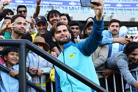AUS Vs PAK, 3rd ODI: Pakistan's Shaheen Shah Afridi, center, takes a photo with fans