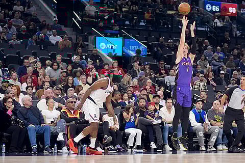 NBA: Toronto Raptors guard Gradey Dick (1) shoots next to Los Angeles Clippers guard James Harden