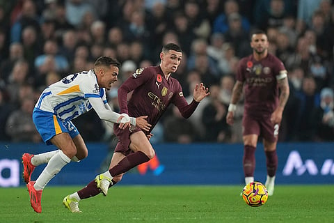 EPL 2024-25: Brighton's Yasin Ayari holds Manchester City's Phil Foden