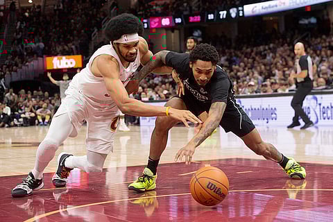 NBA: Cavaliers' Jarrett Allen, left and Nets' Keon Johnson (45) dive for a loose ball