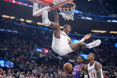 NBA: Los Angeles Clippers guard Kris Dunn (8) celebrates as he dunks