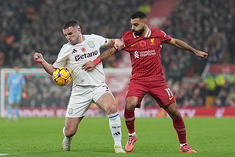 EPL 2024-25: Aston Villa's John McGinn, left, and Liverpool's Mohamed Salah battle for the ball