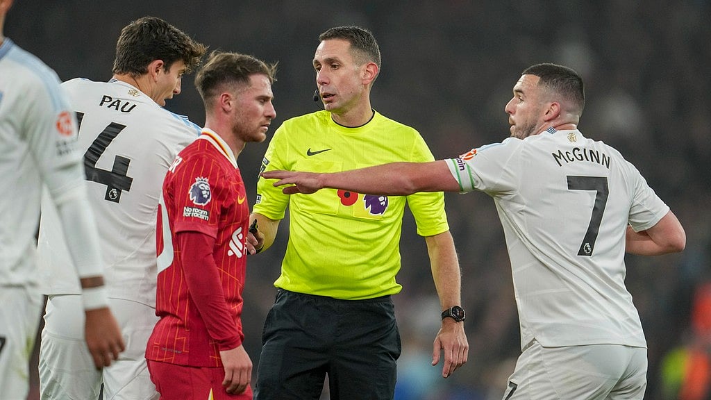 AP : Referee David Coote officiates during the English Premier League match between Liverpool and Aston Villa at the Anfield stadium.