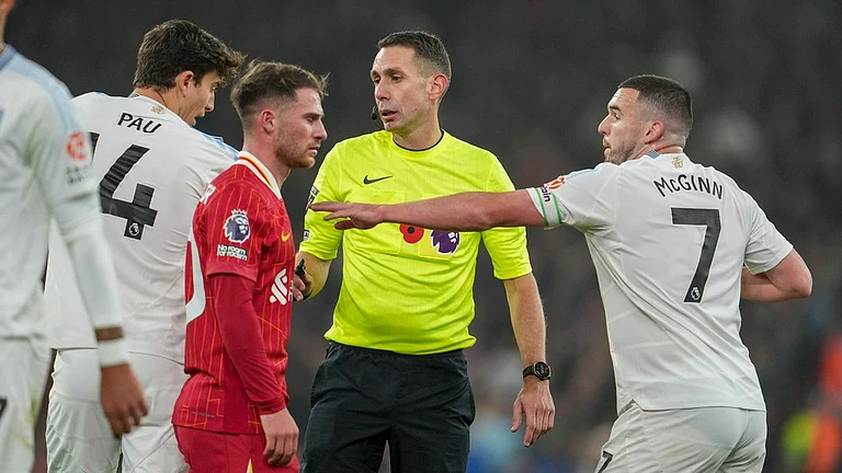 Referee David Coote officiates during the English Premier League match between Liverpool and Aston Villa at the Anfield stadium. - AP
