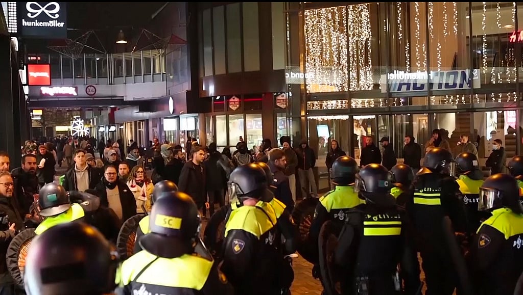 AP : In this image taken from video, police stand guard forming a line near the Ajax stadium, in Amsterdam.