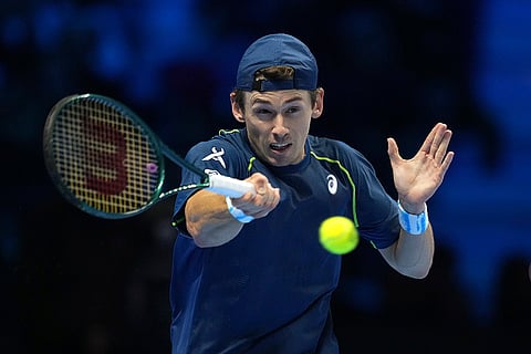 ATP Finals: Australia's Alex de Minaur returns the ball to Italy's Jannik Sinner
