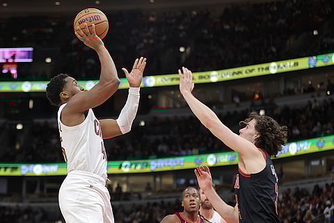 NBA Cavaliers vs Bulls: Cavaliers guard Donovan Mitchell shoots over Bulls guard Josh Giddey