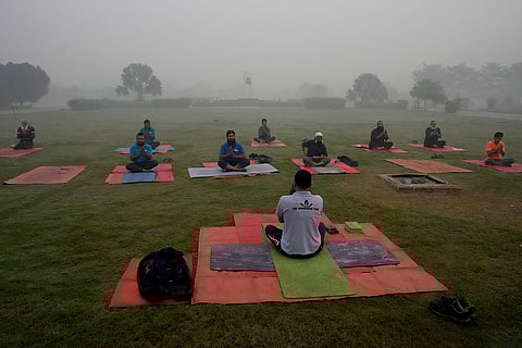People attend yoga class in Lahore