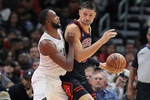 NBA Cavaliers vs Bulls: Cavaliers forward Evan Mobley posts up against Bulls center Nikola Vucevic